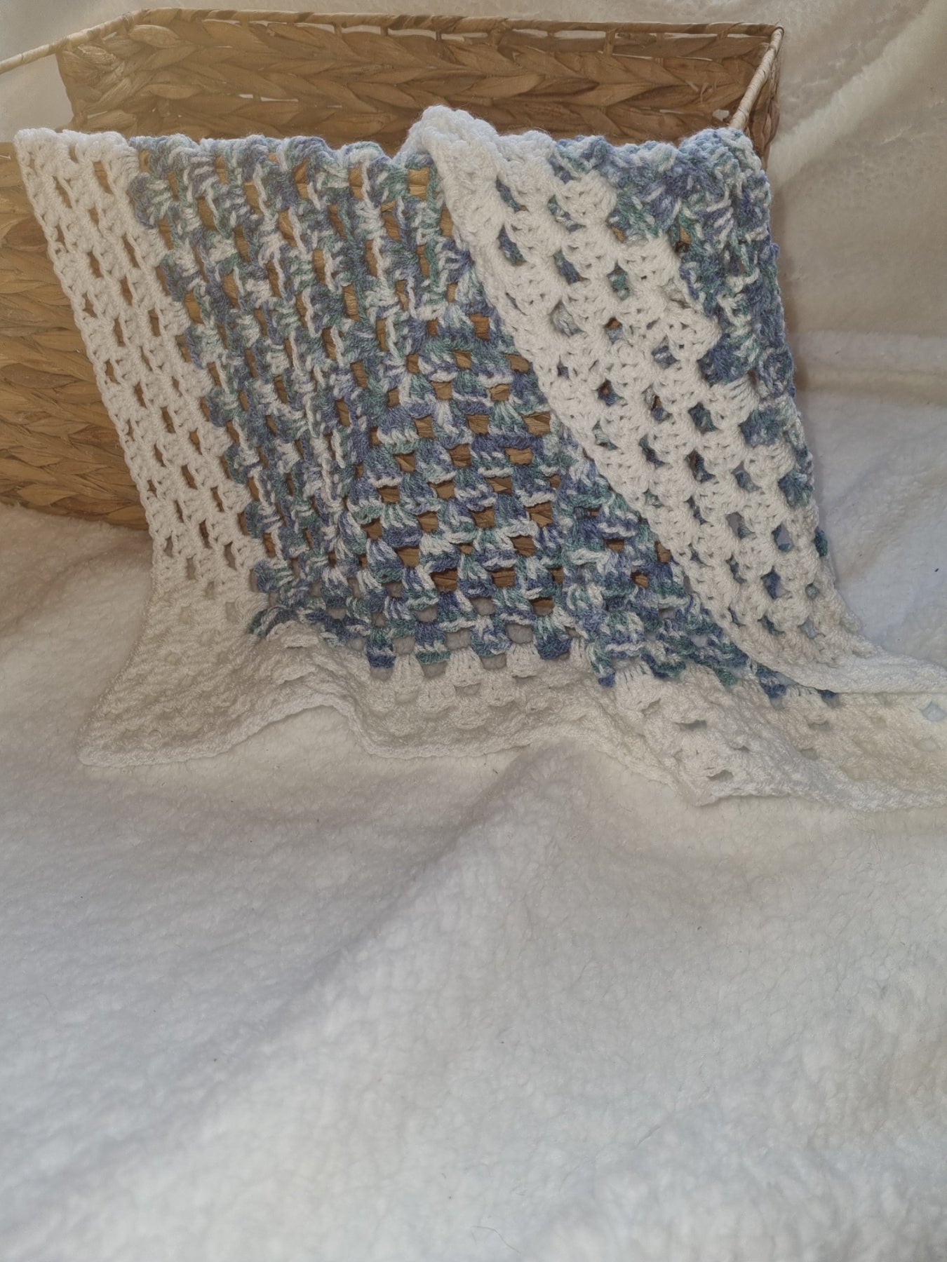 Blue flecked blanket trimmed in white