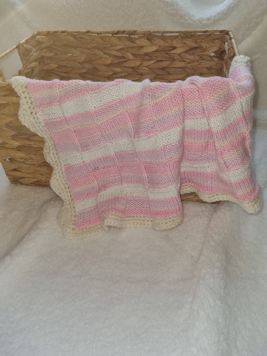 Pink and white car seat blanket