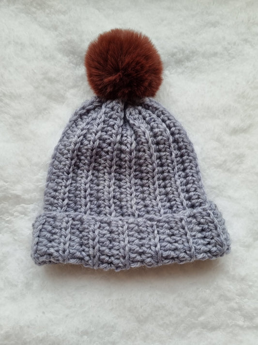 Grey hat with brown faux pompom