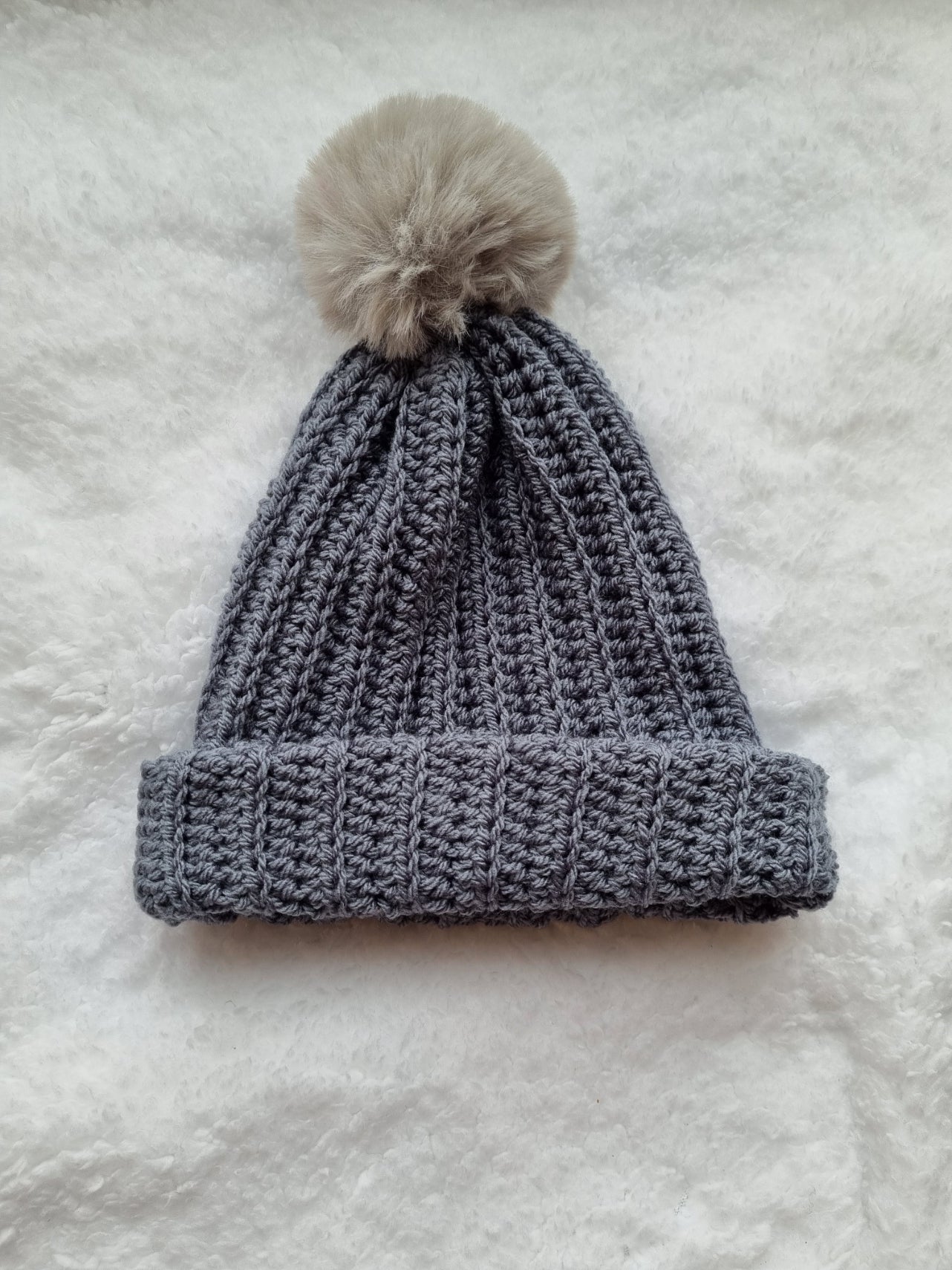 Grey hat, with light grey faux pompom