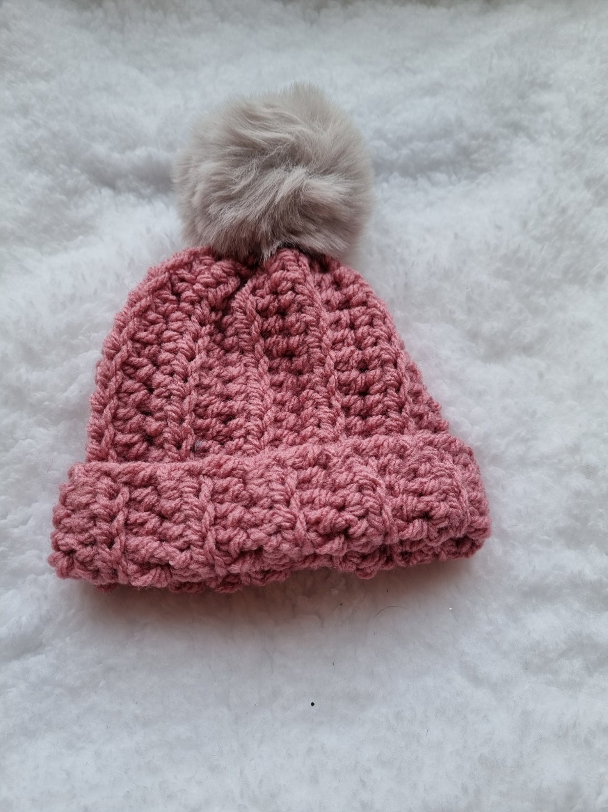 Pink hat with grey faux pompom