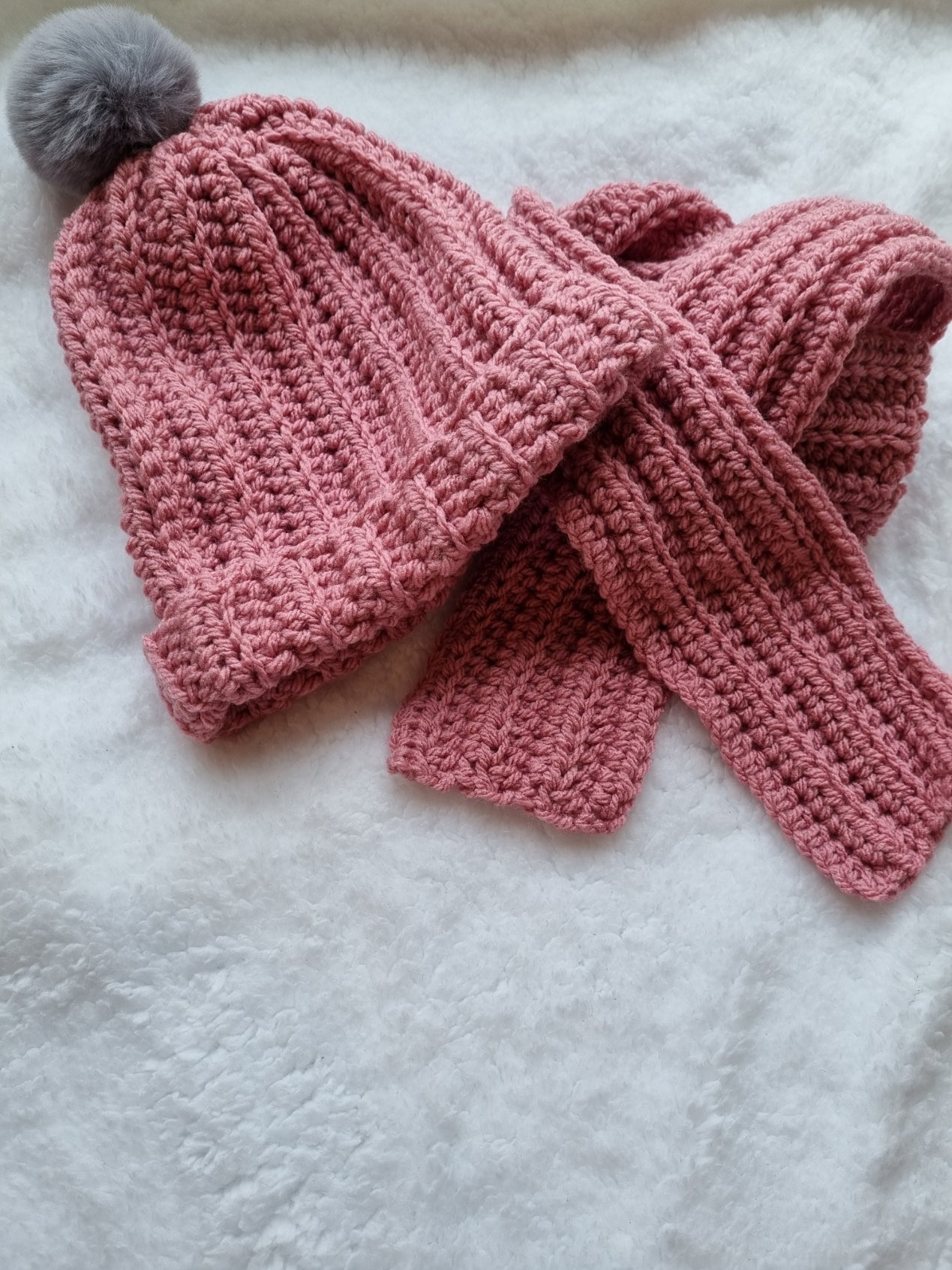 Crocheted pink hat and scarf set