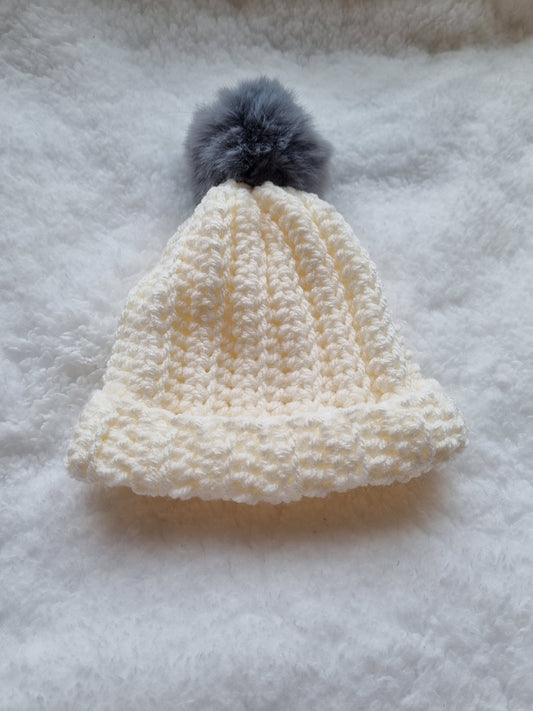 White hat with grey faux pompom